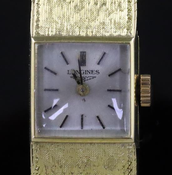 A ladys 18ct gold Longines manual wind wrist watch,